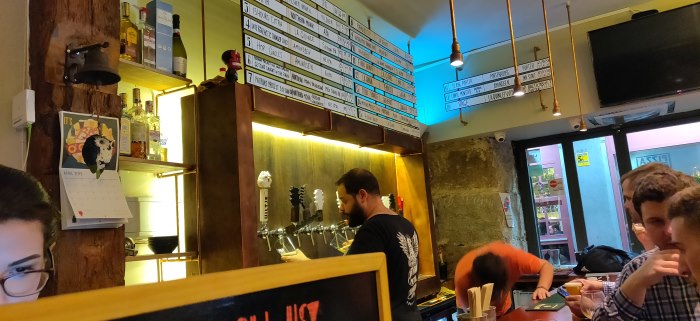 View of the taps and the bartender at Brew Wild